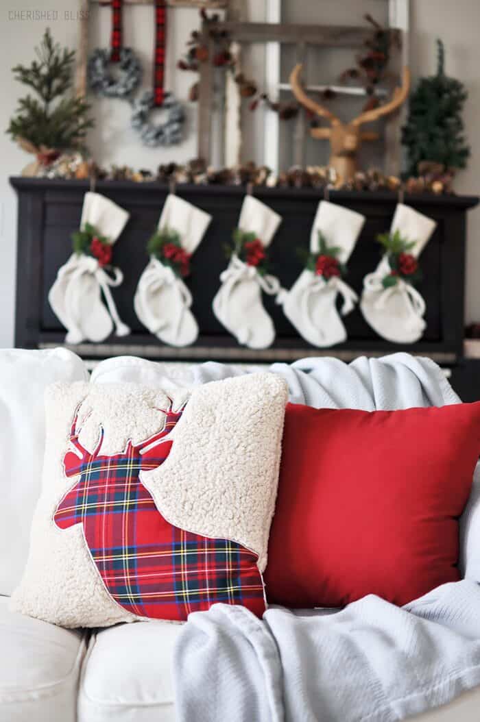 Super Cozy Christmas Mantel with drop cloth stockings, mini wreaths, pine cones, and a deer head!  Super Cozy Christmas Mantel with drop cloth stockings, mini wreaths, pine cones, and a deer head!