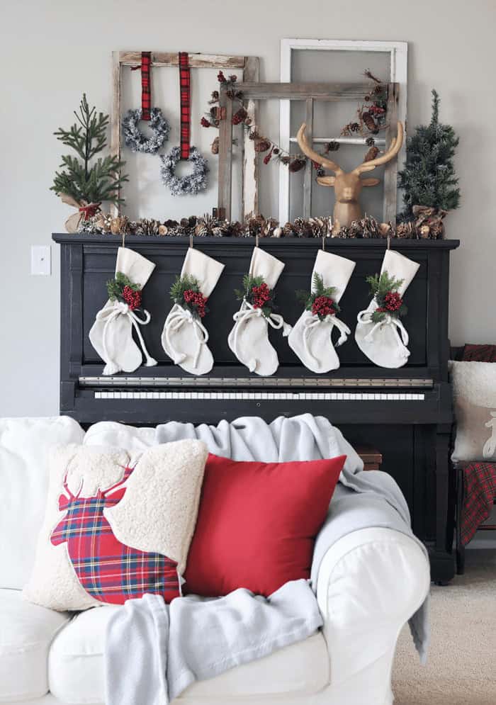 Super Cozy Christmas Mantel with drop cloth stockings, mini wreaths, pine cones, and a deer head!  Super Cozy Christmas Mantel with drop cloth stockings, mini wreaths, pine cones, and a deer head!
