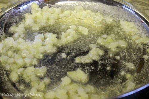 cooking chopped onions in a skillet