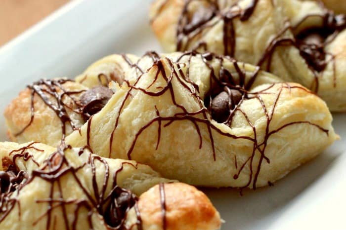 Nutella Puff Pastries on a white plate.