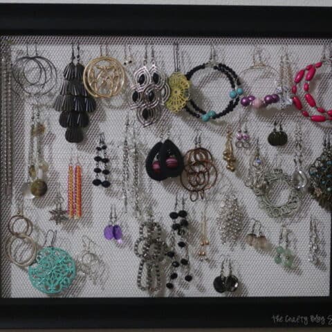 the finished mesh earring holder frame with earrings hanging from it