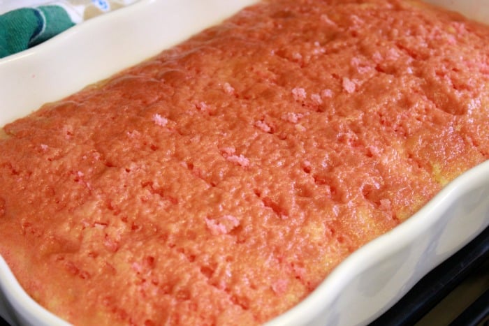 Cake with jello poured into the poke holes.