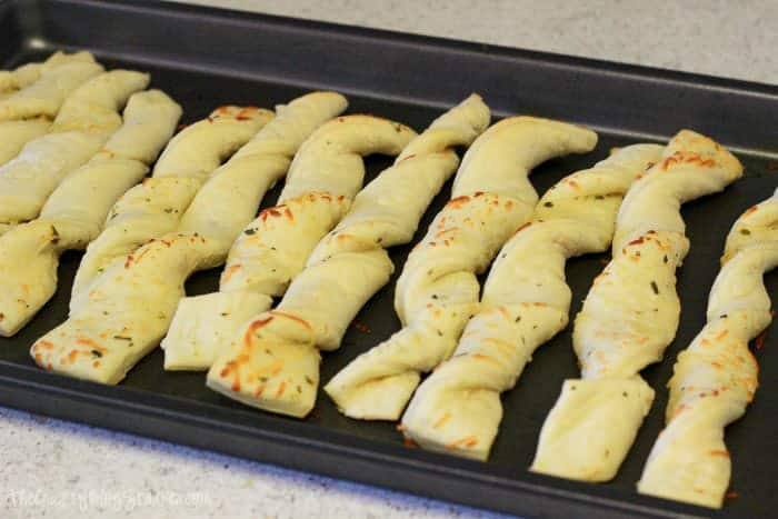 Breadsticks cooked on a baking sheet.