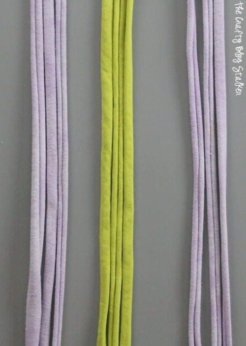 strips of tshirt yarn grouped to braid