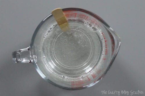 image of melted soap in a glass measuring cup