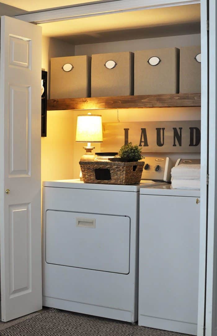 This Laundry Room Makeover transforms this little closet with wasted space into a functional laundry area with just a few simple changes! 