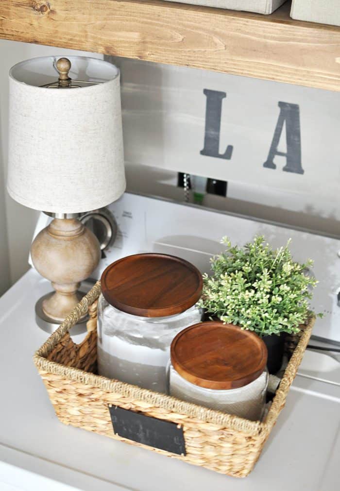 This Laundry Room Makeover transforms this little closet with wasted space into a functional laundry area with just a few simple changes! 