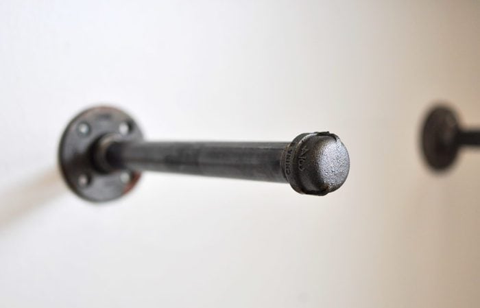 Metal pipe hanging out of the wall 