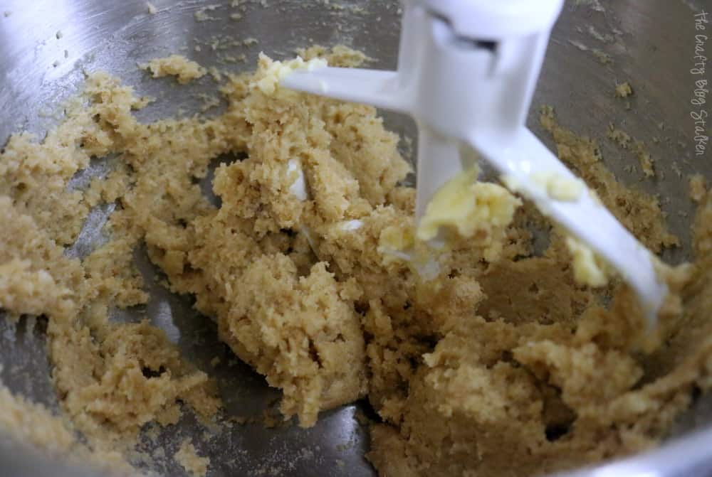 In a mixing bowl cream the brown sugar, white sugar, and shortening together. 