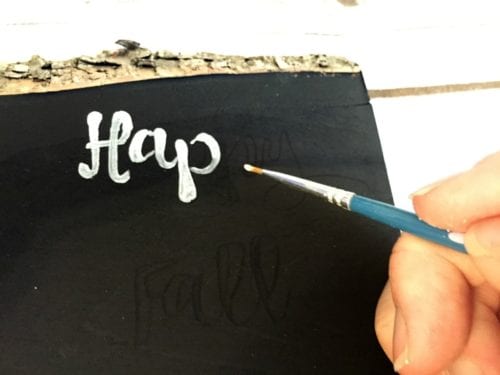 painting words with a thin paintbrush