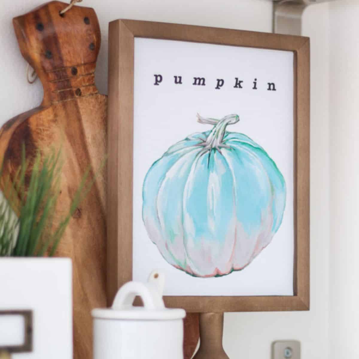 Framed watercolor print of a pale blue pumpkin labeled