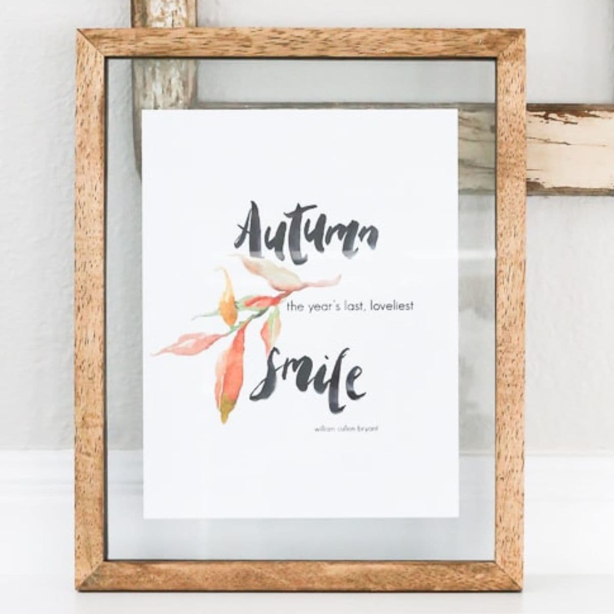 Framed autumn printable featuring watercolor leaves and the quote
