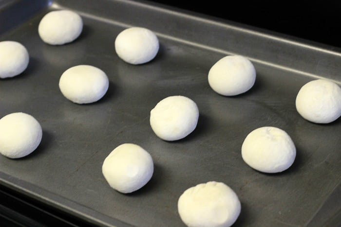 frozen rolls on a baking sheet