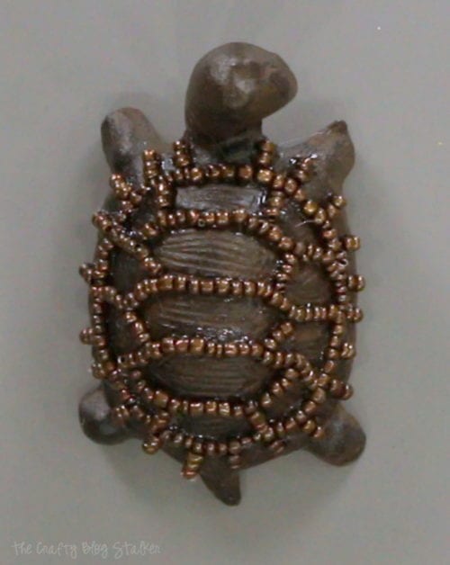 seed beads around the outlines of the turtle's shell