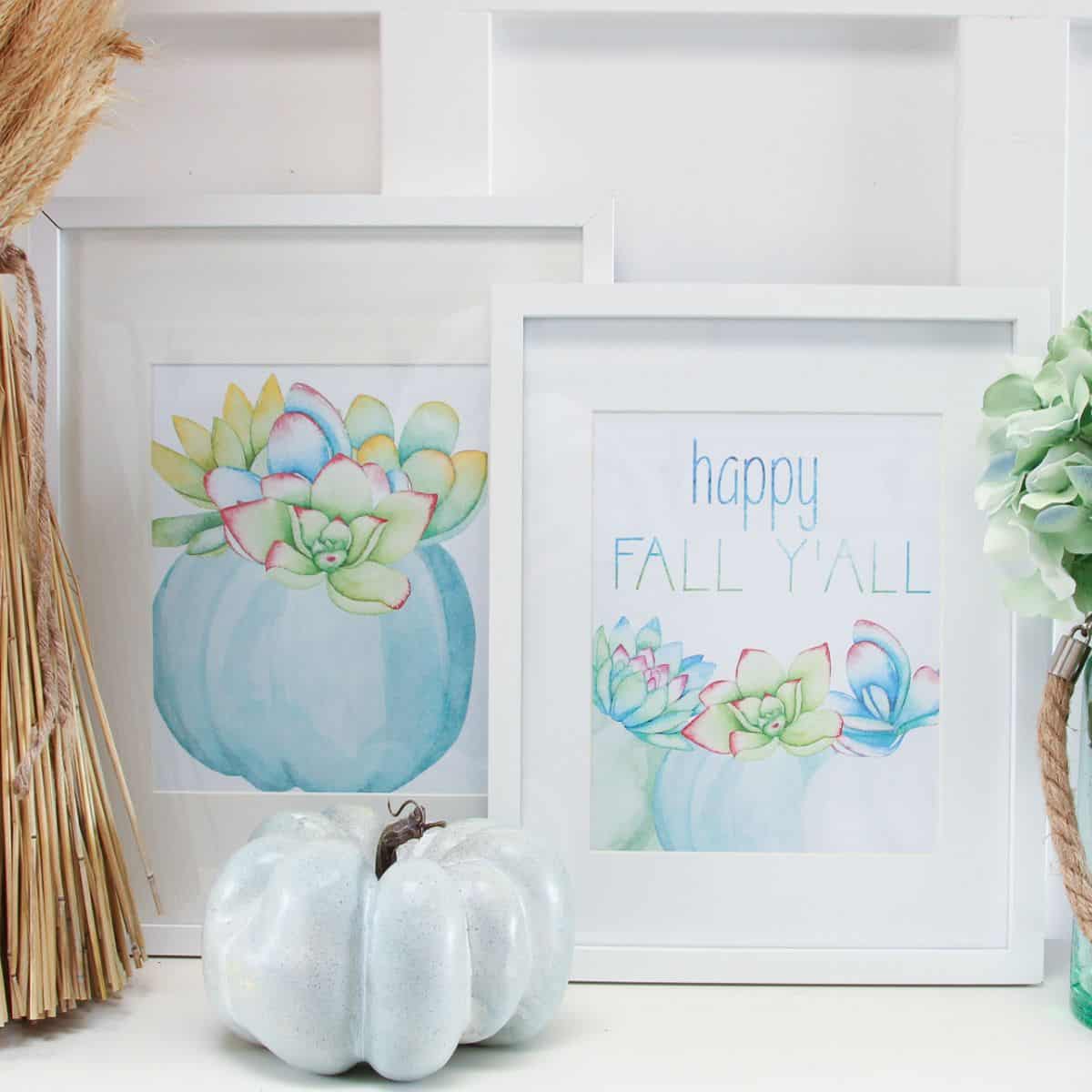 Two framed fall printables featuring watercolor blue pumpkins with colorful succulents, one with the phrase