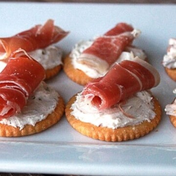 Easy cracker appetizers laid out on a plate.