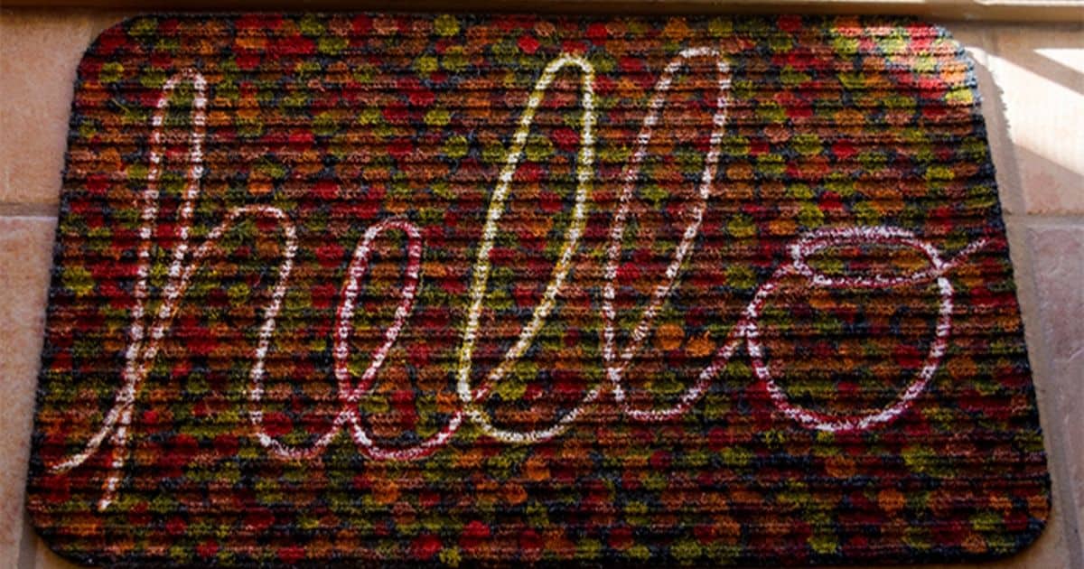 Make an easy Autumn "Hello" mat with a Dollar Store rug