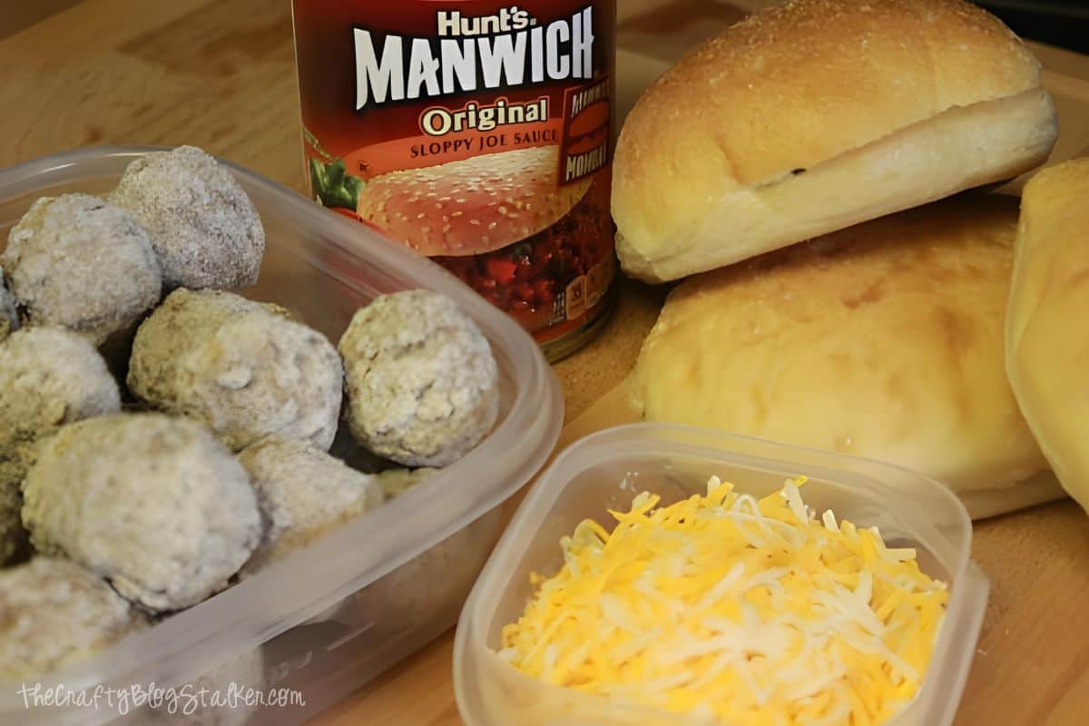 Manwich sauce, frozen meatballs, shredded cheese and hard rolls.