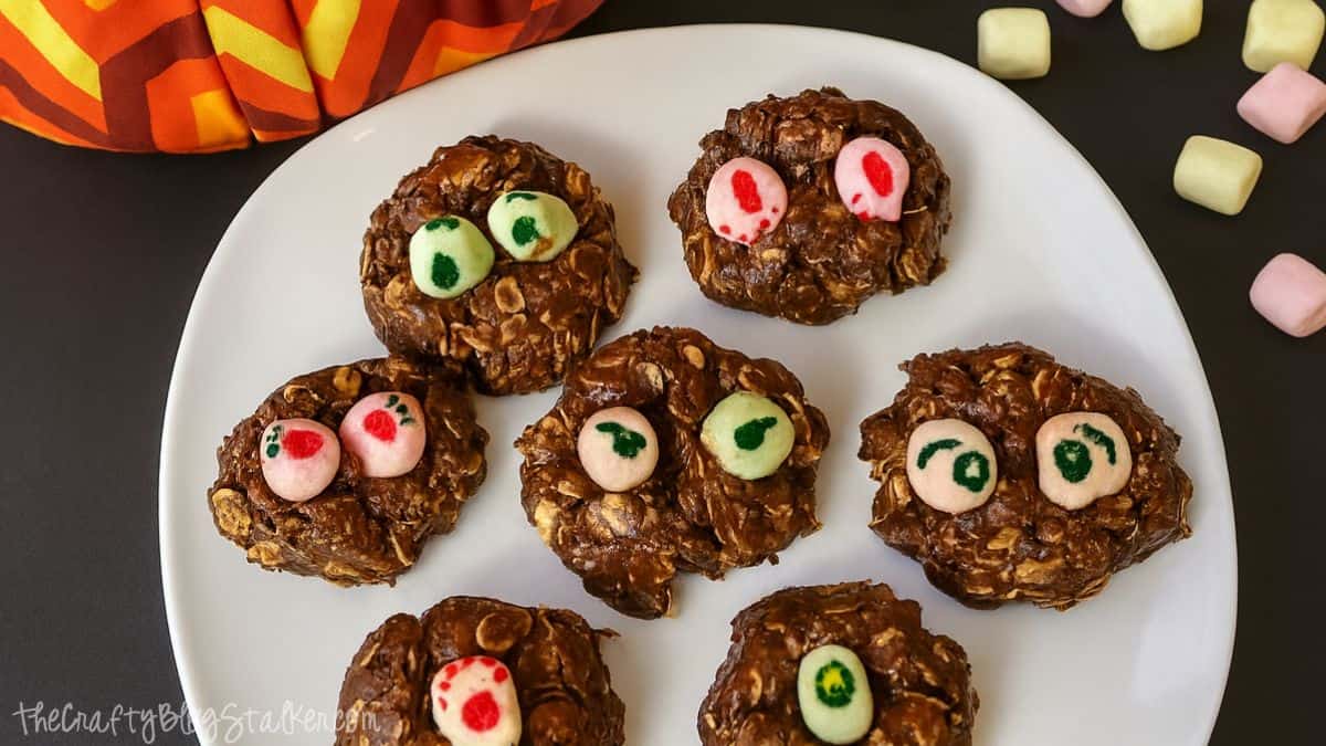 A plate of fun no-bake Nutella Monster Cookies topped with colorful marshmallow "eyes," perfect for a spooky treat that kids will love to make and eat!
