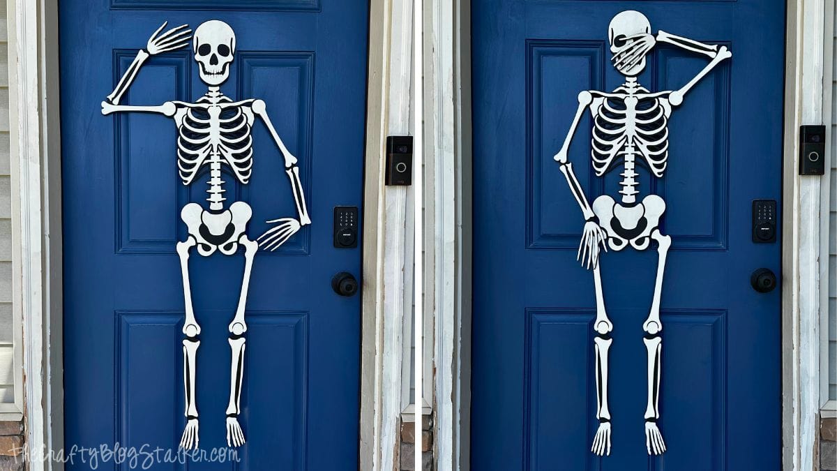 Two jointed skeleton decorations hang on blue front doors, each posed playfully with arms raised and crossed, creating a fun Halloween display.
