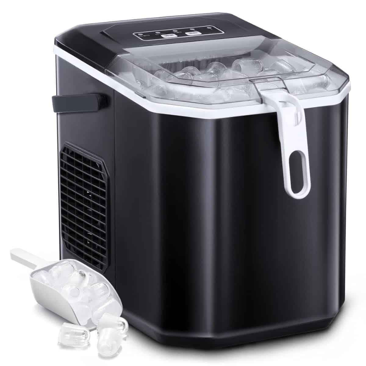 A black countertop ice maker filled with ice cubes, shown with a clear lid and a white scoop placed beside it.