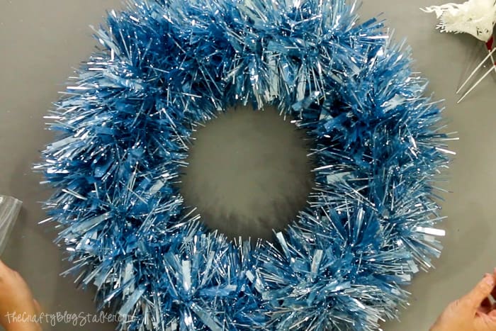 Tinsel garland wrapped around a styrofoam wreath form.