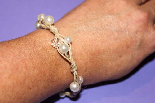 bracelet being worn on a wrist