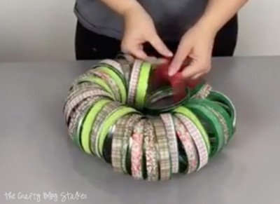 tying the the ribbon string of canning lid rings