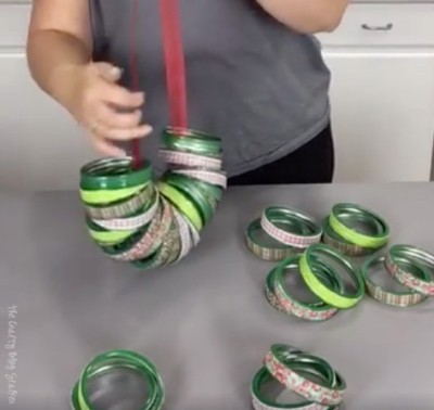 stringing the canning lid rings onto a piece of ribbon