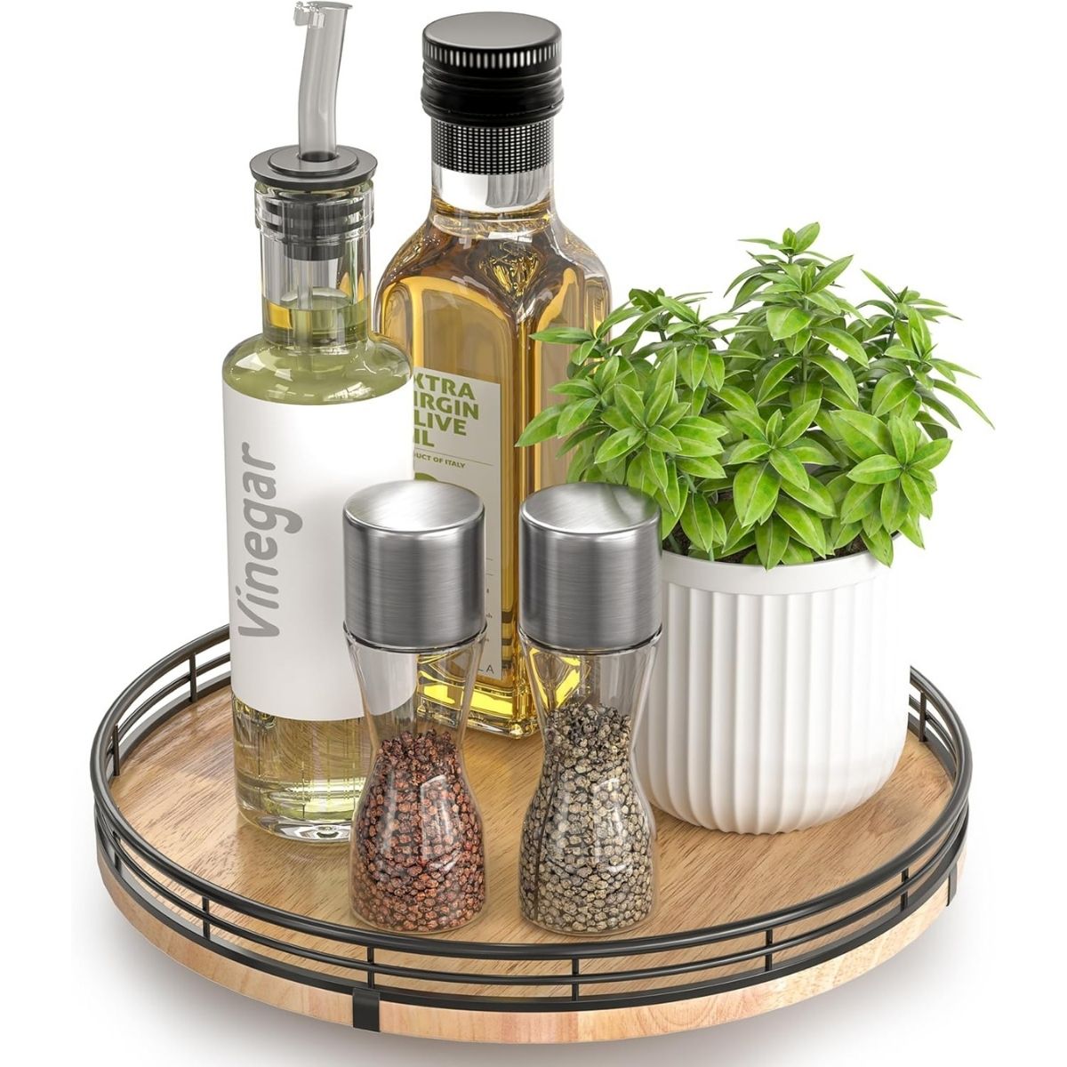 Round wooden turntable holding oil and vinegar bottles, salt and pepper grinders, and a small potted plant, styled as a countertop organizer.