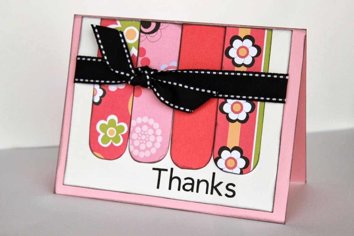 a handmade card that says "thanks" on the front