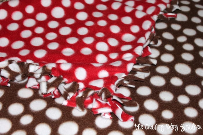 How to Make a Quick and Easy Tied Fleece Blanket, a tutorial featured by top US craft blog, The Crafty Blog Stalker.