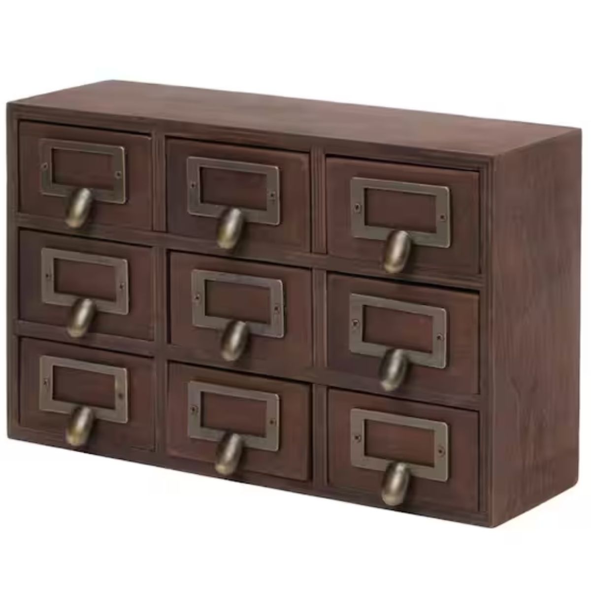 Wood apothecary-style storage cabinet with nine small drawers, each featuring a metal label holder and pull handle, shown against a white background.