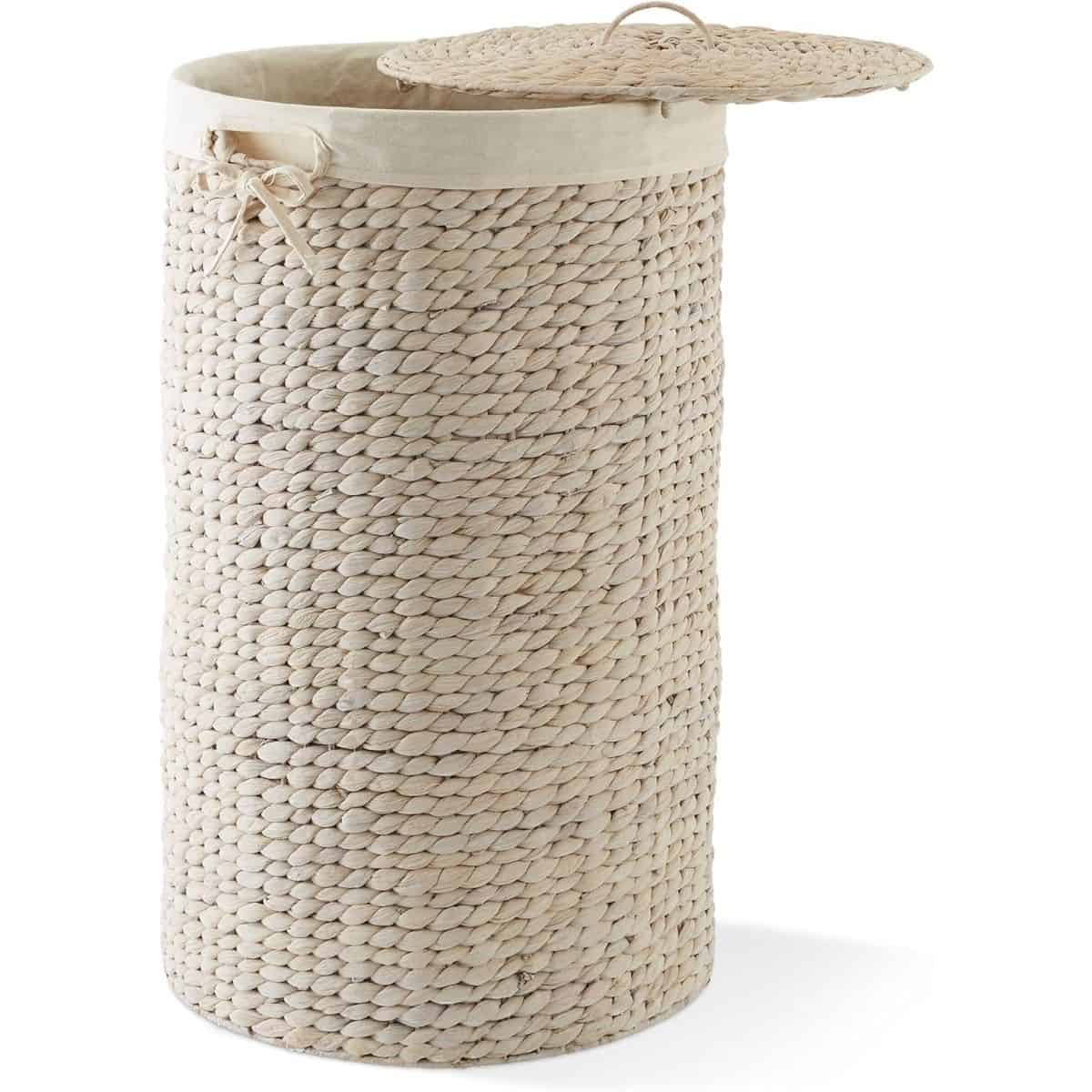 Tall woven laundry hamper with a round lid, fabric liner, and side handles, shown open against a plain background.