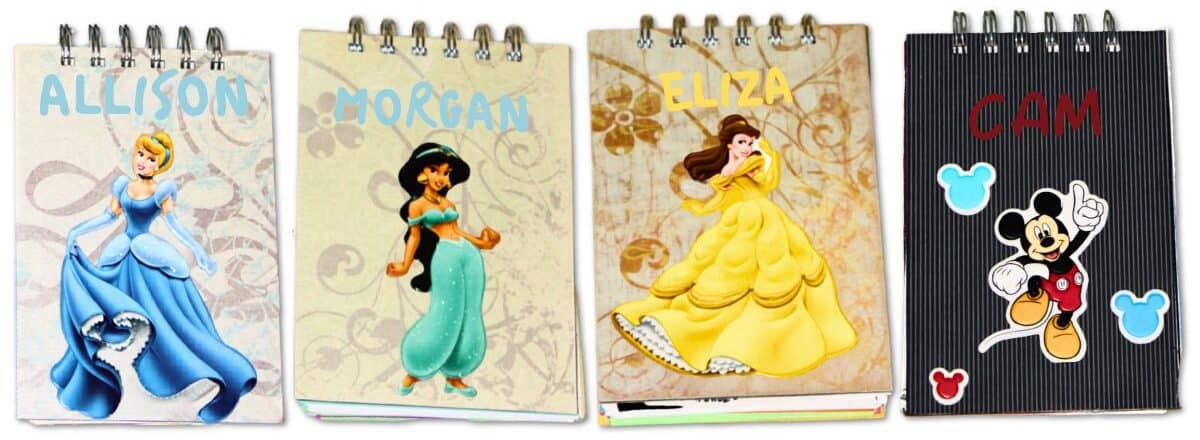 Four personalized Disney autograph books featuring Cinderella, Jasmine, Belle, and Mickey Mouse with colorful character covers and custom names.