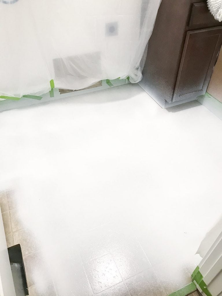 Got ugly Vinyl Floors? With this step by step tutorial you can learn how to Paint Vinyl Floors to look like the trendy cement tile everyone loves!