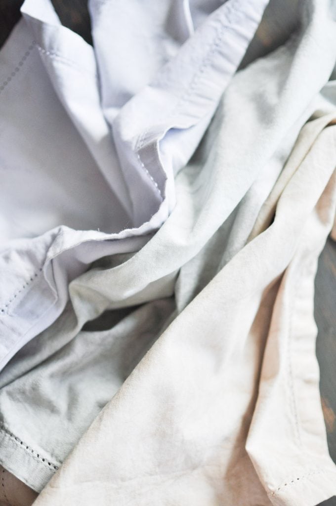 Enhance your next home decor project by learning how to dye fabric with milk paint and provide a timeless look for any project big or small!