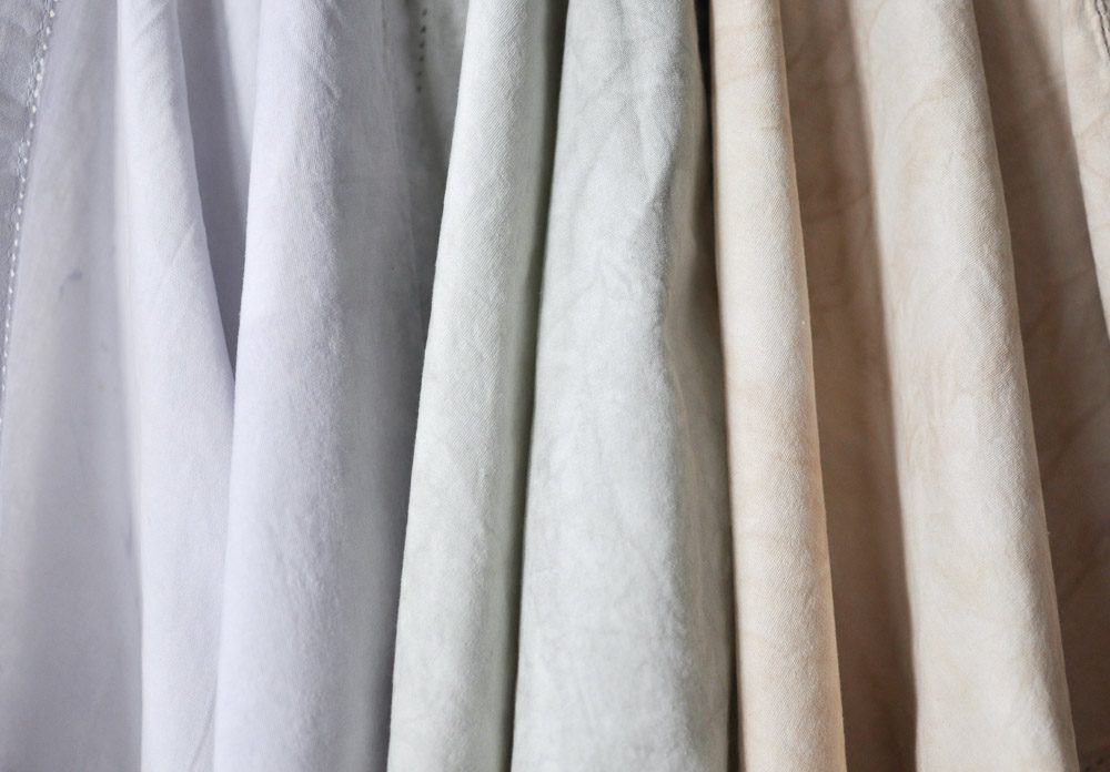 Enhance your next home decor project by learning how to dye fabric with milk paint and provide a timeless look for any project big or small!