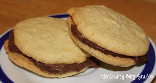 a plate with two sandwich cookies