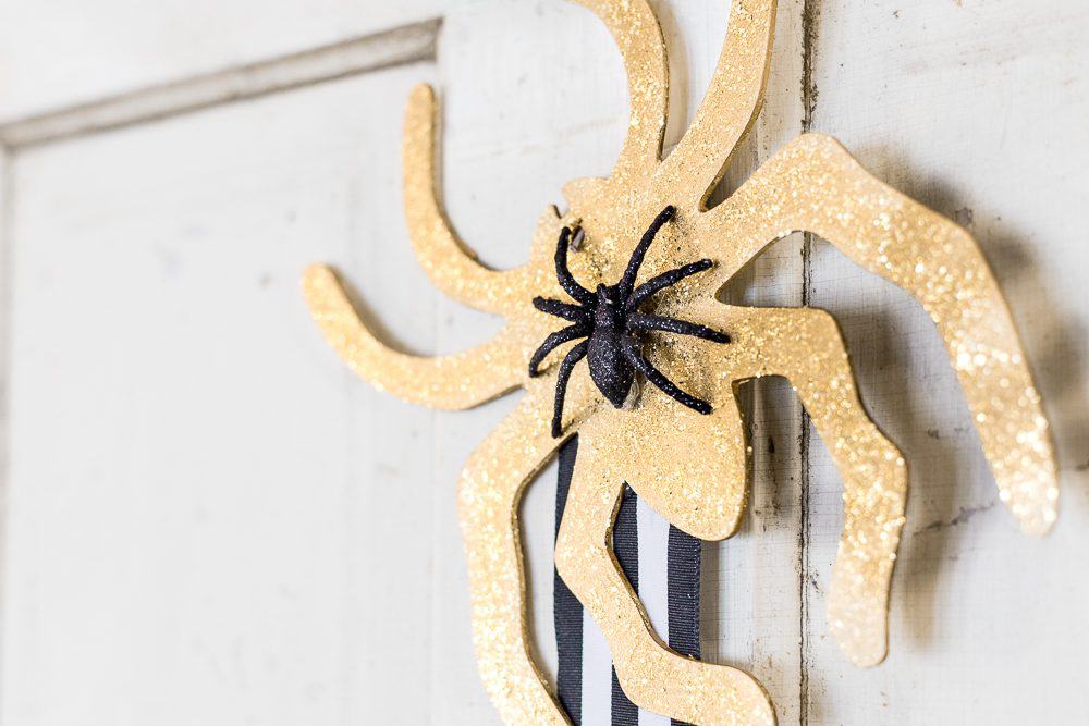 Learn how to make this easy Embroidery Hoop Halloween Wreath. It's the perfect addition to your door for all the trick or treaters to come! 
