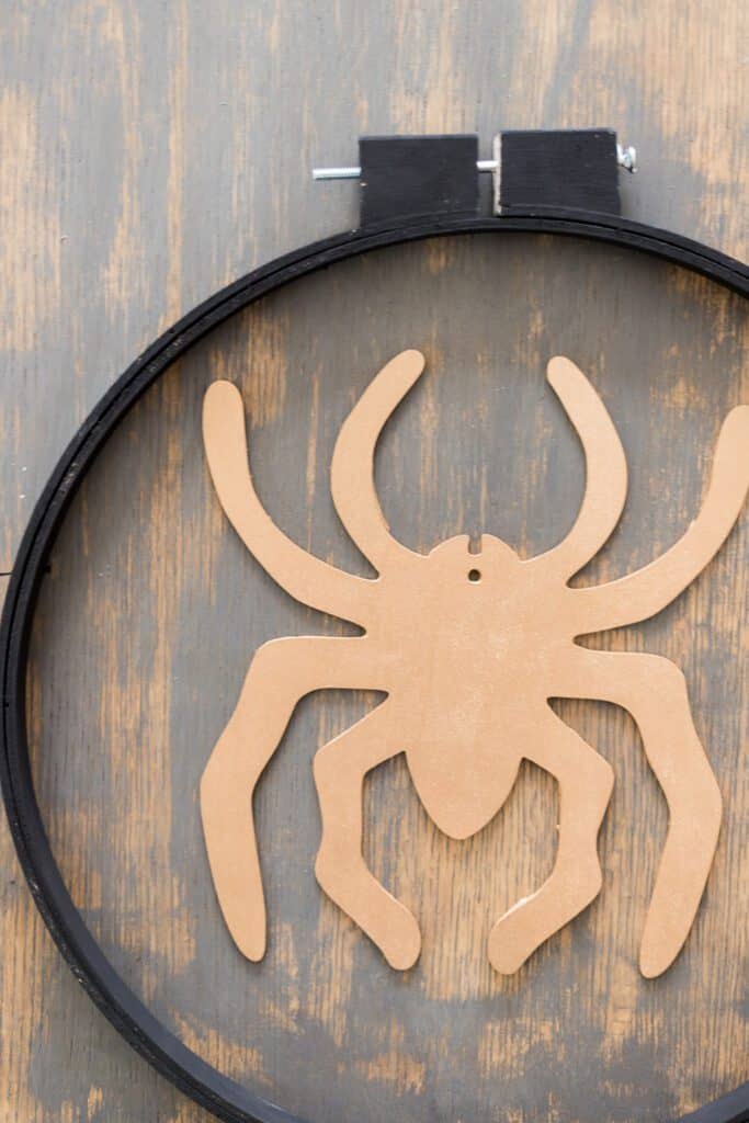 Learn how to make this easy Embroidery Hoop Halloween Wreath. It's the perfect addition to your door for all the trick or treaters to come! 