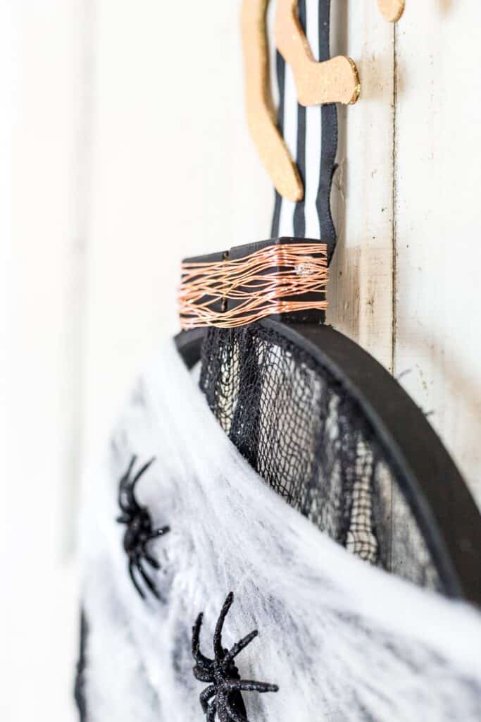 Learn how to make this easy Embroidery Hoop Halloween Wreath. It's the perfect addition to your door for all the trick or treaters to come! 