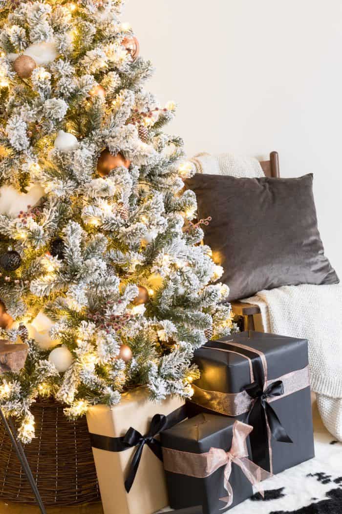 This Flocked White and Copper Christmas Tree brings coziness into any space! Learn how to decorate a tree with these simple tips! 