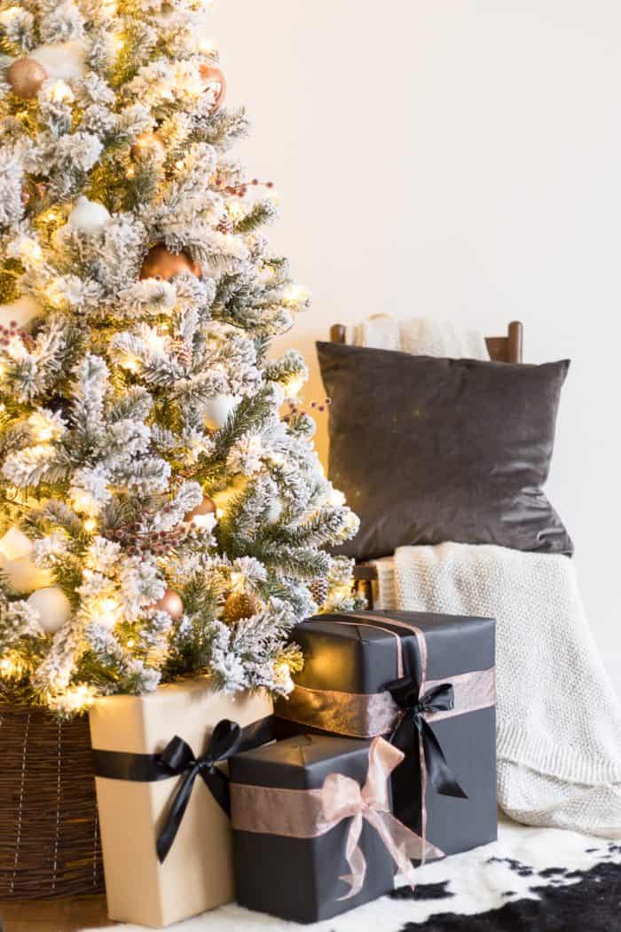 This Flocked White and Copper Christmas Tree brings coziness into any space! Learn how to decorate a tree with these simple tips!