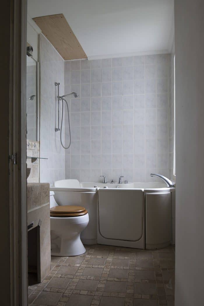 Come take a tour of this Black and White Industrial Bathroom before and after. This is proof small bathrooms can be luxurious.