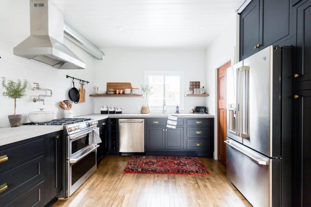 Dark inset cabinets, wood accents, mixed metals and industrial appliances give this Rustic Modern Kitchen a cozy, clean look.