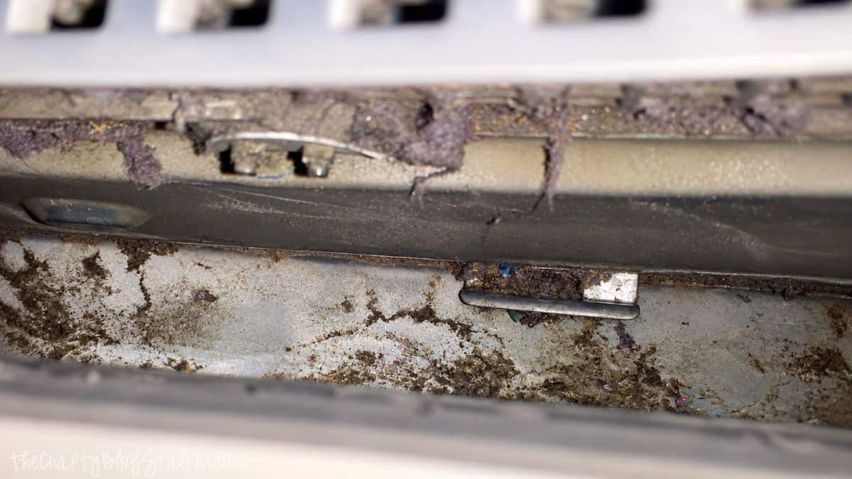 Cleaned dryer vent compartment after removing most of the lint, dust, and debris buildup.