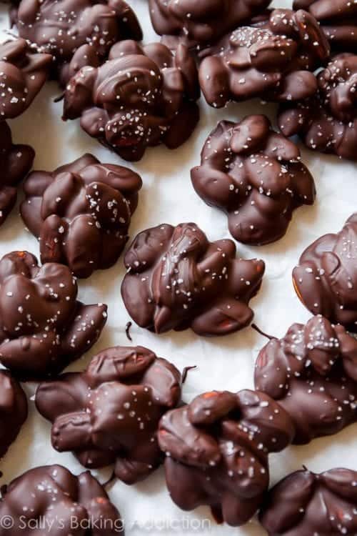 sea salt dark chocolate almond clusters spread out on display