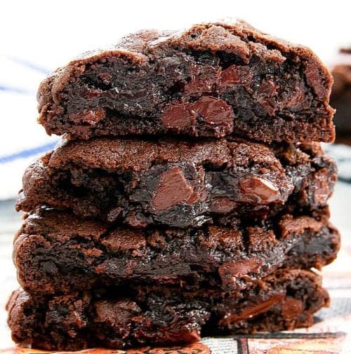 close-up of a stack of dark chocolate chip cookies with the insides showing