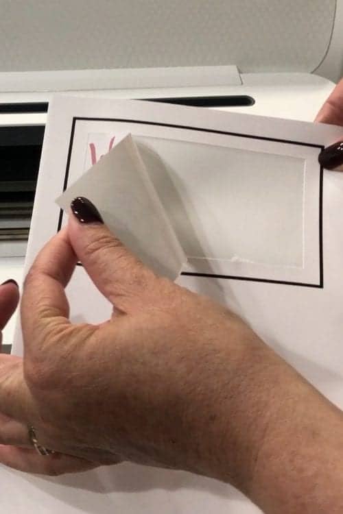 How to Print and Cut in Cricut Design Space by popular US craft blog, The Crafty Blog Stalker: image of a woman peeling off a label. 